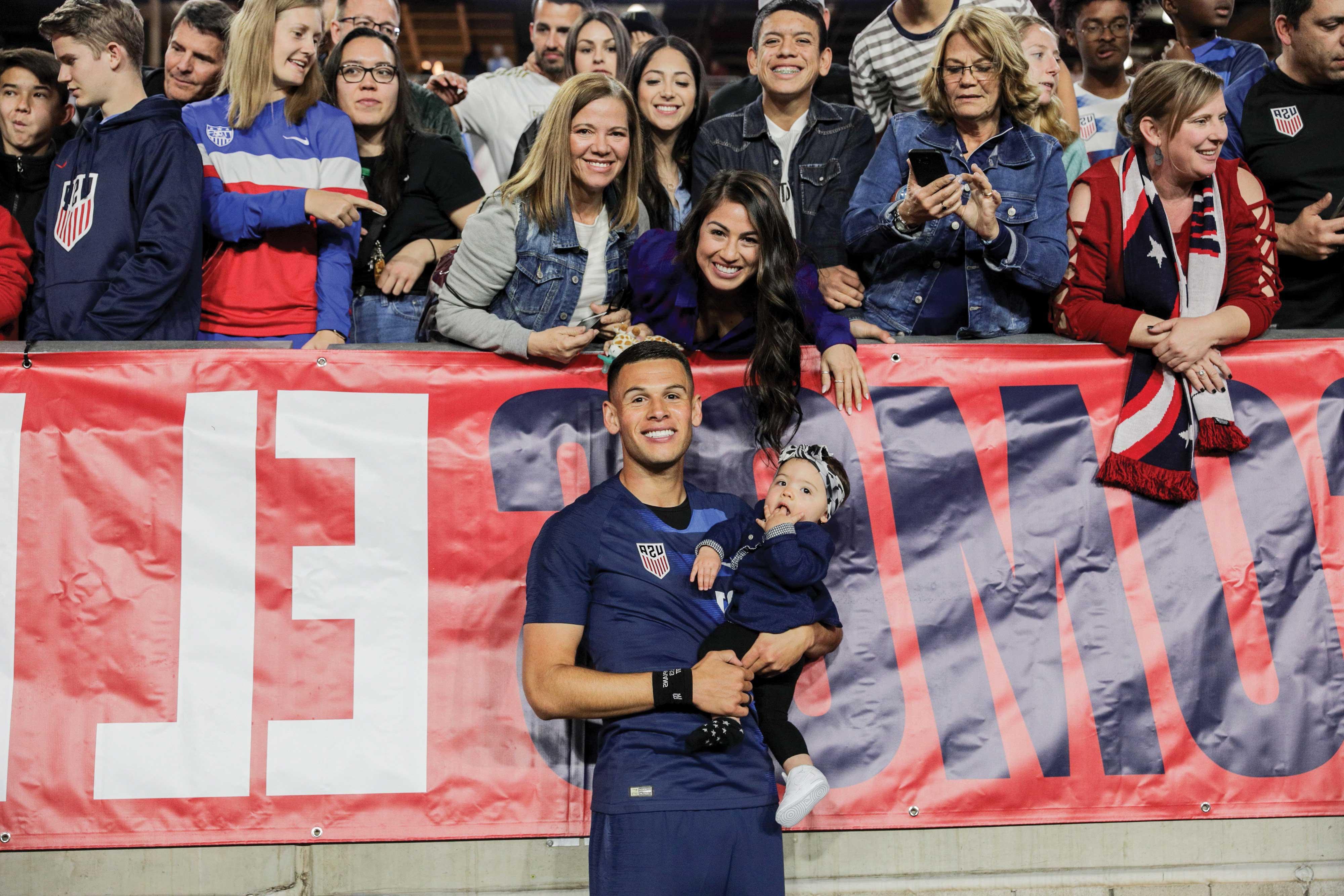 Christian Ramirez and family on sidelines